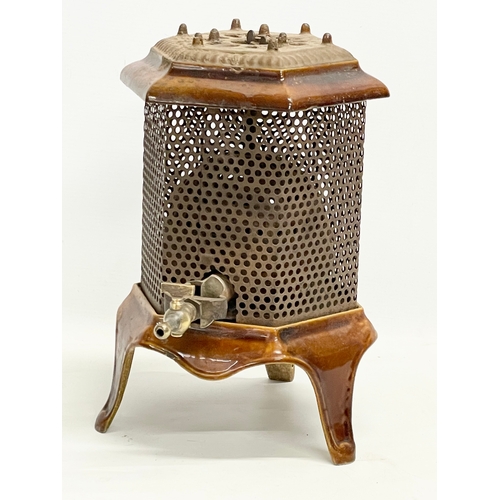 271 - An early 20th century enamelled gas heater. 21x31x31cm