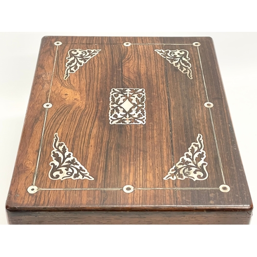 148 - A Victorian rosewood vanity box with Mother of Pearl inlay and cut glass bottles with silver plated ... 