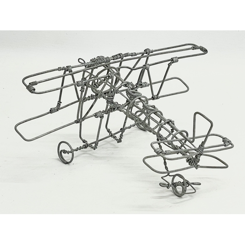 379 - A model Biplane made from wire. 22x19cm