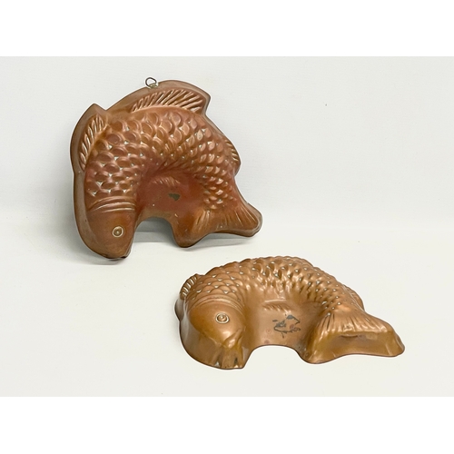 272 - A pair of large early 20th century copper jelly moulds. 28cm