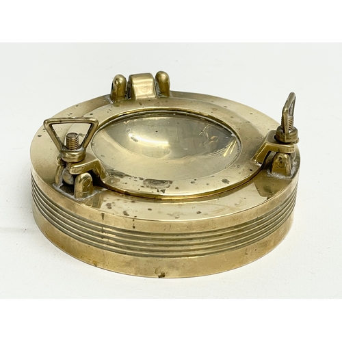 274 - A vintage ships porthole ashtray. 11cm