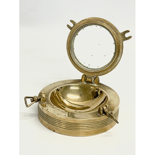 274 - A vintage ships porthole ashtray. 11cm