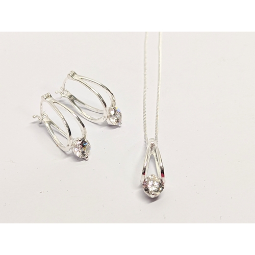 467 - A silver necklace and earring set