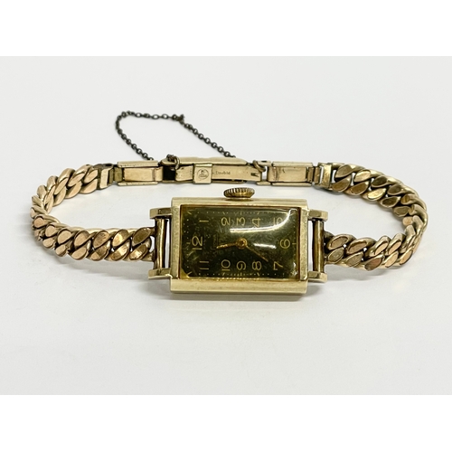 468 - A vintage 14ct gold ladies watch. Case only.