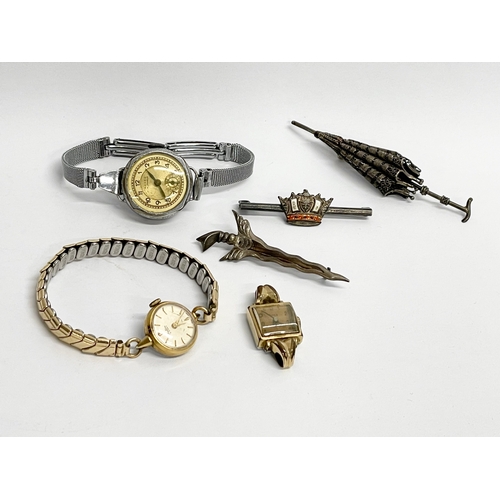 427 - A collection of vintage watches and brooches.