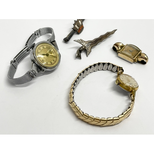 427 - A collection of vintage watches and brooches.