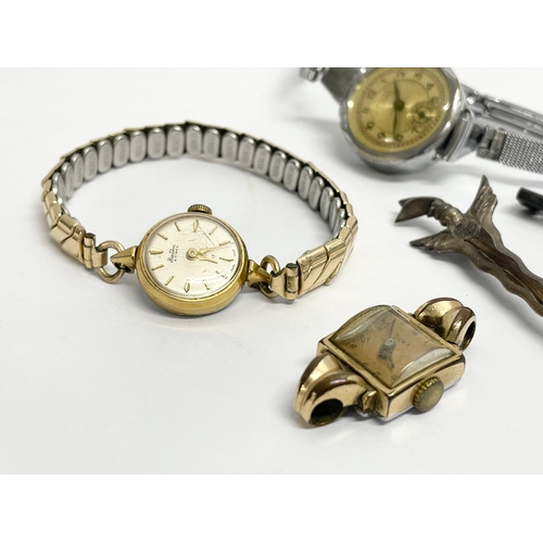 427 - A collection of vintage watches and brooches.