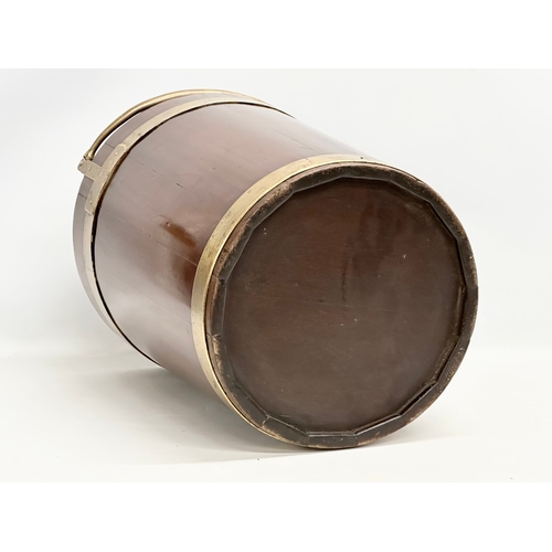 27 - A George III mahogany brass bound peat bucket with brass handle. Circa 1790. 38x37x46cm not includin... 