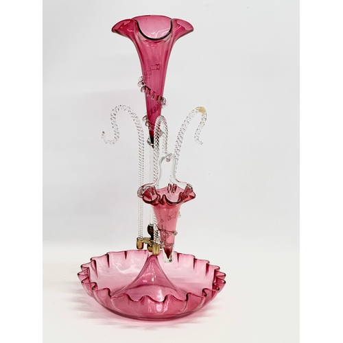 28 - A large Victorian Cranberry Glass epergne. 27x51cm