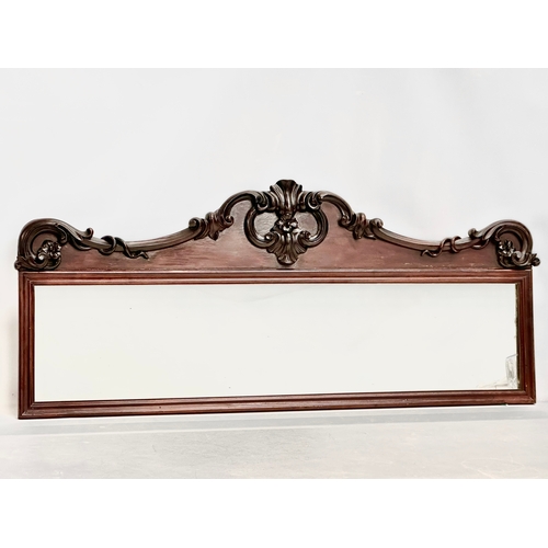 36 - A Victorian carved mahogany framed mirror. 107x46cm