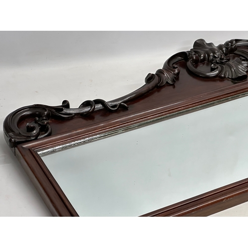 36 - A Victorian carved mahogany framed mirror. 107x46cm