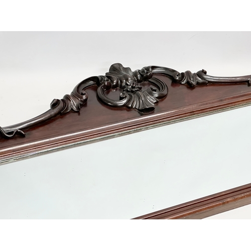 36 - A Victorian carved mahogany framed mirror. 107x46cm