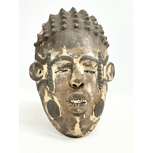 45 - 3 early 20th century African face masks. 28cm