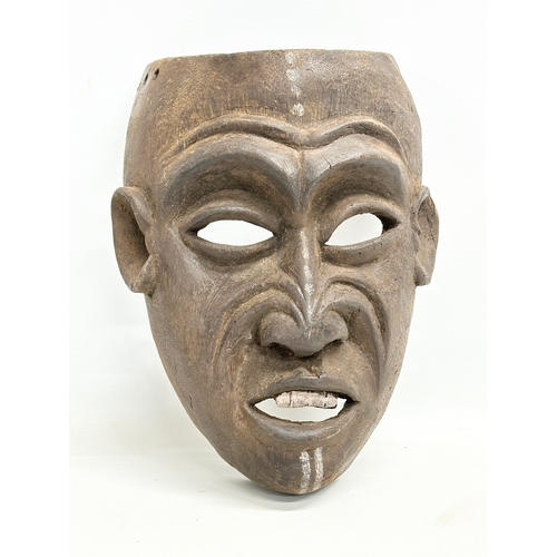 45 - 3 early 20th century African face masks. 28cm