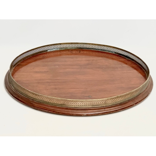 50 - A large late Victorian mahogany tray with pierced brass gallery. 56x6cm