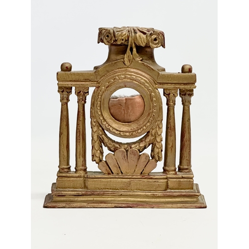 31 - A 19th century gilt wooden pocket watch stand. 20.5x5.5x22.5cm