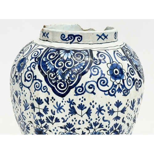 196 - A late 19th/early 20th century Dutch Delft Earthenware jar with lid. Signed. 24cm