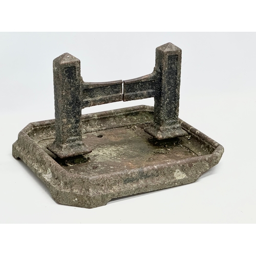 164 - A Victorian cast iron boot scraper. 37x35x24cm