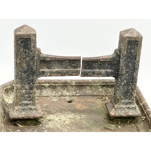 164 - A Victorian cast iron boot scraper. 37x35x24cm