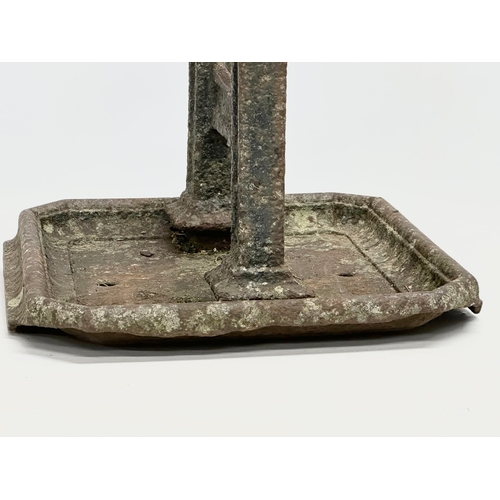 164 - A Victorian cast iron boot scraper. 37x35x24cm