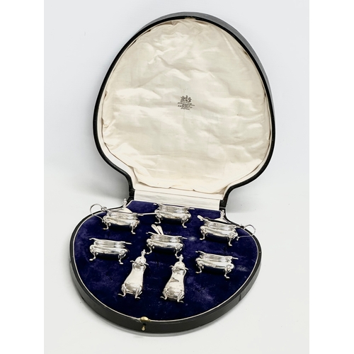 476 - A large cased silver condiment set. Birmingham 1919. 295 grams without liners. Case measures 27x29cm