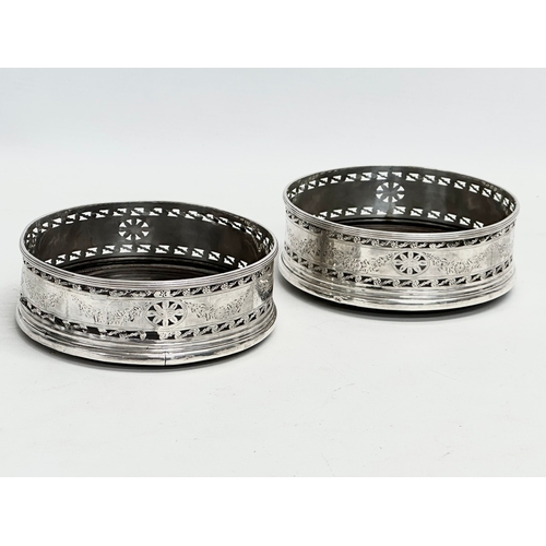 477 - A pair of late 19th century Irish silver coasters. Dublin mark. Stamped O, with Irish harp. 1884.  1... 