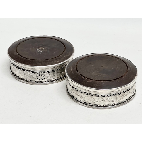 477 - A pair of late 19th century Irish silver coasters. Dublin mark. Stamped O, with Irish harp. 1884.  1... 