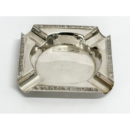 489 - An ornate silver ashtray. Sheffield, 1931. 96 grams. 9x9cm