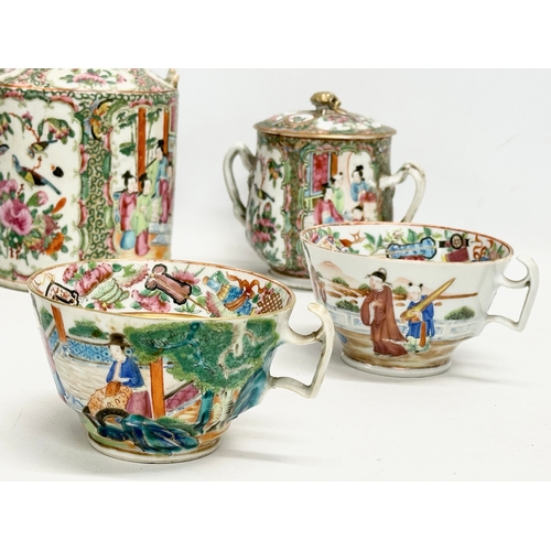 65 - A 7 piece mid/late 19th century Chinese Canton Famille Rose tea service. Teapot, 2 handled sugar bow... 