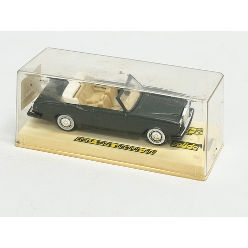 593 - 3 model cars on display cases. 22x11x11cm