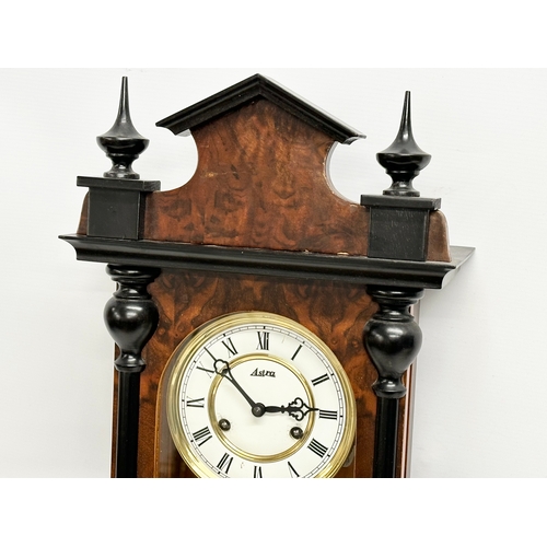 107 - A good quality Victorian style Burr Walnut and mahogany Vienna wall clock by Astra. With pendulum an... 