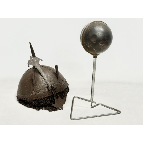 39 - An old reproduction Indo-Persian steel battle helmet on stand.