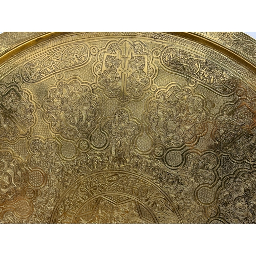 193 - A large early 20th century Indian brass tray. 70cm