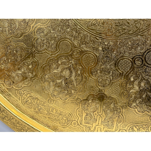 193 - A large early 20th century Indian brass tray. 70cm