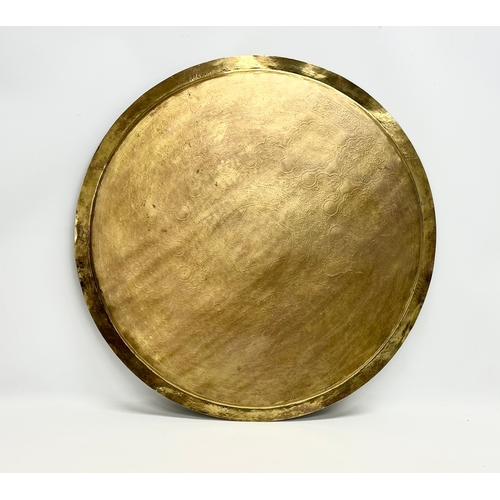 193 - A large early 20th century Indian brass tray. 70cm