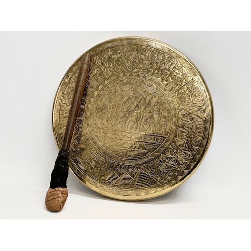 177 - A late 19th century Egyptian Revival brass gong. 27cm