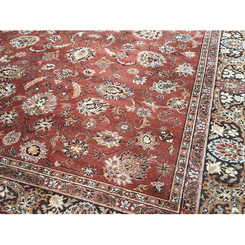 1160 - A large Middle Eastern style rug. 249x367cm