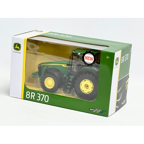 602 - An unused Britains John Deere 8R 370 tractor in box. 26.5x13x15cm