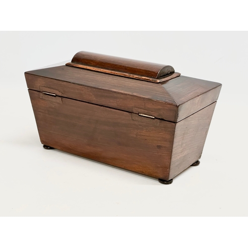 109 - A Regency rosewood sarcophagus tea caddy. Circa 1810. 28x14x16cm