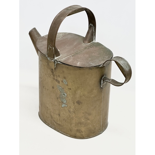 195 - A late 19th century watering can and a 2 handled pan. 42x20x41cm