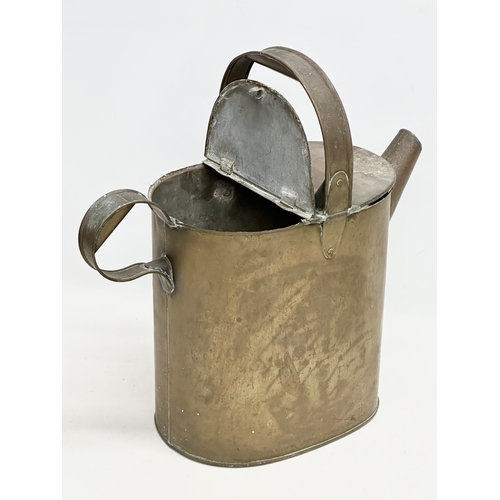 195 - A late 19th century watering can and a 2 handled pan. 42x20x41cm