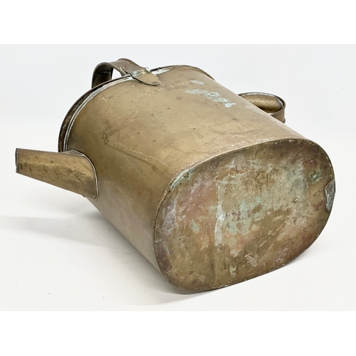 195 - A late 19th century watering can and a 2 handled pan. 42x20x41cm