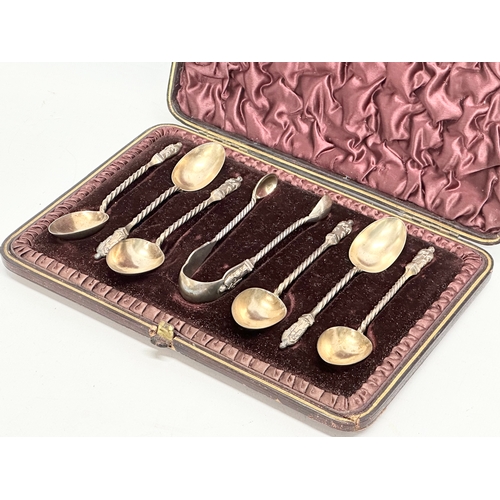 465 - A set of silver apostle spoons and tongs in case. Birmingham. 80 grams.