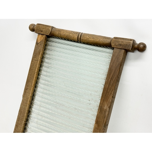 211E - An early 20th century washboard. 41x76cm