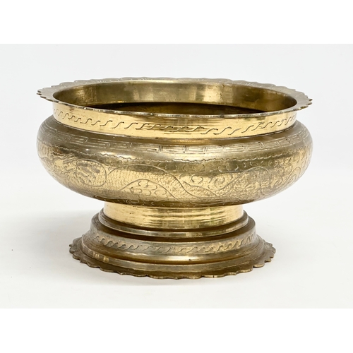 65C - A large late 19th/early 20th century Chinese brass bowl. 25x15cm