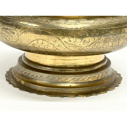 65C - A large late 19th/early 20th century Chinese brass bowl. 25x15cm