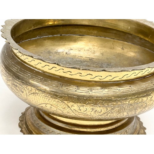 65C - A large late 19th/early 20th century Chinese brass bowl. 25x15cm