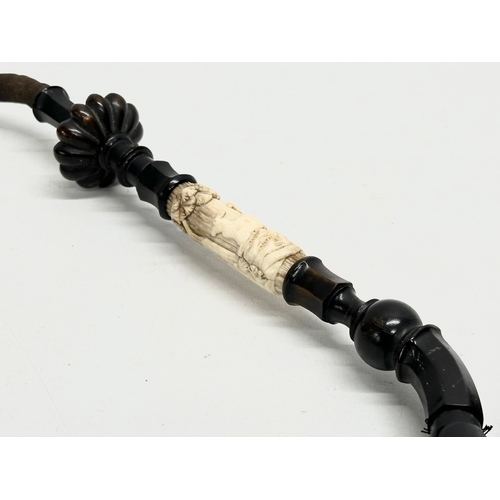 65D - A large early 20th century bone, horn and wooden pipe. 59cm