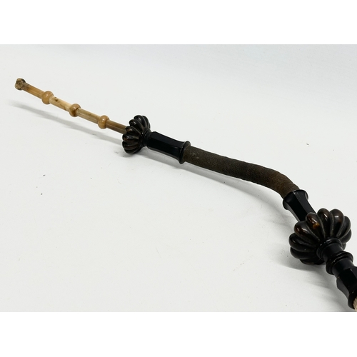 65D - A large early 20th century bone, horn and wooden pipe. 59cm