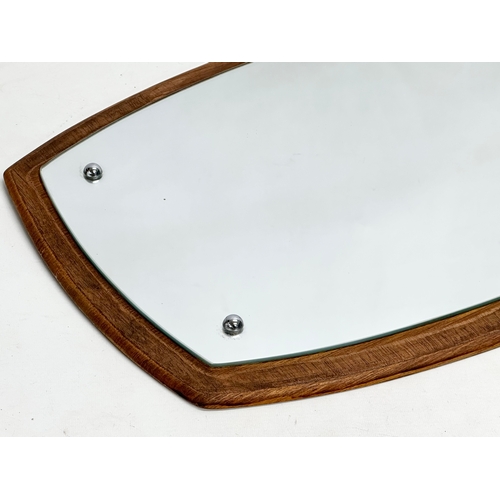 1170 - A Mid Century teak framed mirror. 75x44cm